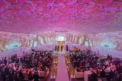 The Temple House in Miami works with United Projection to offer 3-D projection mapping services for corporate and social events. For one wedding ceremony, the room was transformed into a pink cherry blossom forest. As the bride walked down the aisle, motion graphics caused rose petals to “fall” slowly from the trees, creating a romantic effect.