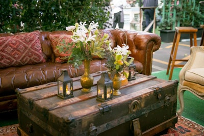 Tying into the rustic look, the Abbey Party Rents lounge featured elegant leather couches and a wooden trunk that served as a coffee table. Vintage rugs completed the cozy, upscale lounge feel.