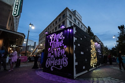 Augmented-reality-enabled storytelling booths in New Orleans are made from repurposed shipping containers that were outfitted using found materials such as wood and steel from the city.