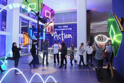 The sports experience showcased a neon basketball court, with glowing nets and backboards of various colors and heights. Guests were invited to shoot hoops and interact with members of the Brooklyn Nets Team Hype.