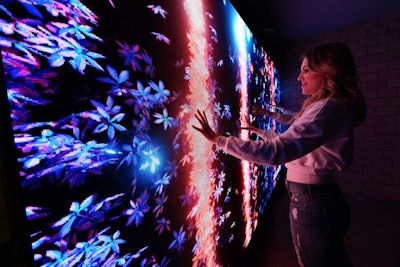 Two motion-reactive kinetic LED walls allowed guests to play with the deconstructed floral elements of the Super Saturday Night logo.