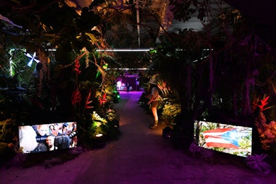 Safari tour guides led guests through Puerto Rico’s El Yunque rainforest with native plants, dancers painted as creatures, and hologram animals. Throughout, screens displayed a video of AT&T and Lopez’s hurricane relief efforts in the region.