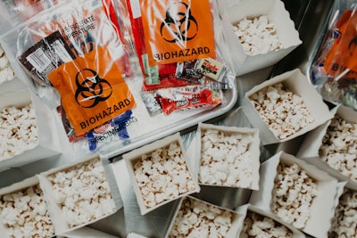 Before heading into the screening, guests could grab popcorn or on-theme specimen bags stuffed with candy.