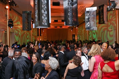 Modern, mosaic-inspired chandeliers accentuated the dance floor, which was packed on a Tuesday night.