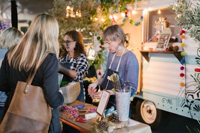 A craft area allowed guests to make pom-pom garlands and other camp-theme flair.