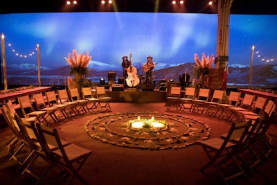 On one end of the venue, Soulflower Design Studio created a circular seating area inspired by the mandala symbol of Hinduism and Buddhism. A projected background scene, produced by Impact Lighting Audio Video, displayed changing images of a tranquil lake and mountain setting. Acoustic duo the Easy Leaves performed in the space.
