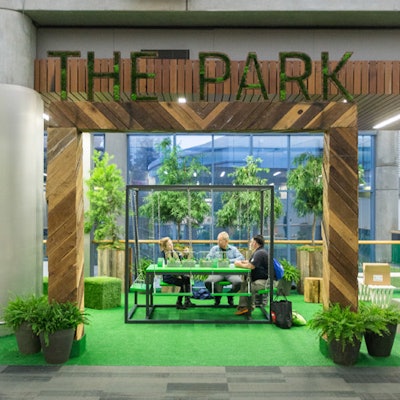 The greenery-filled Park was another space for attendees to meet. Design details such as swingset-like seats at a table added a playful touch.