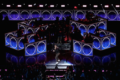 Timberlake performed a medley of his songs on stage against a backdrop that included oversize blue panels resembling stereo speakers.