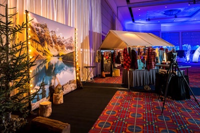 Throughout the ballroom, two photo booth setups from Paparazzi Tonight depicted mountain scenes during various seasons. Nearby tents served as dress-up stations, where guests could don fake beards, plaid scarves, shirts, hats, and other props.