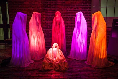 Guardians of Time, by Austrian artist Manfred Kleinhofer, features lamp sculptures draped in hooded robes, which are assembled to resemble guards participating in a ritual.