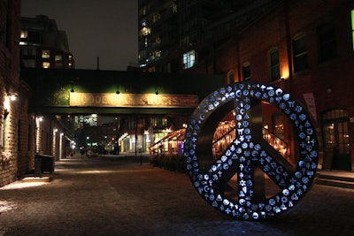 Symbolic Peace, a sculpture of a peace sign that's illuminated with a variety of symbols, was created by the festival’s executive producer, Mathew Rosenblatt.