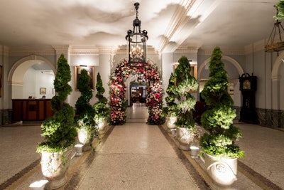 The New York event took place March 14 at private club Down Town Association. The entrance hall featured potted spiral topiary and a floral arch.