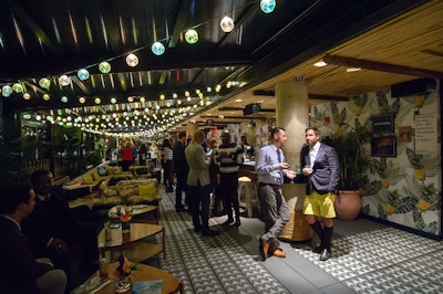 Bermuda Tourism Authority CEO Kevin Dallas and Jason Corrente chat during the Bermuda Style Session at Tiki Tabu, a tropical-themed rooftop bar and event space at Sixty LES in New York City.