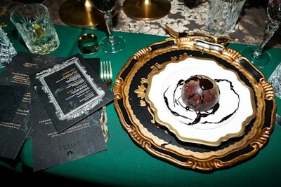 Dishes, which were served on plates with a gold-color trim, included the Oil Well—mini molten chocolate cakes that were served with dark chocolate sauce and 16-karat gold dust.