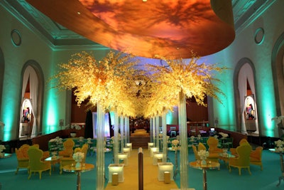 For the Art Gallery of Ontario's Picasso Gala, designer Jeffry Roick of McNabb Roick used bold colors to evoke Picasso’s work. Kelly-green carpeting and yellow Victorian-inspired lounge furniture were complemented by golden trees and green lighting by AusCan Media Productions.