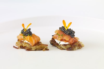 While potato latkes are traditionally known as a Hanukkah favorite, they can be Passover-appropriate when made with matzo meal. Wolfgang Puck Catering’s version is topped with a Fuji apple puree.