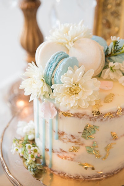 One highlight was an ombré, watercolored cake topped with blue and white macarons and flowers.