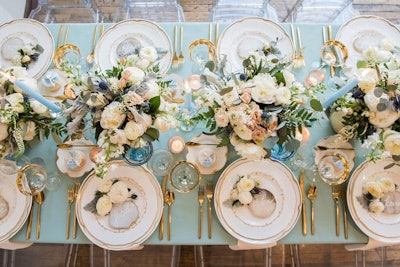 A Perfect Event designed the brunch with a soft, spring-inspired color palette, featuring ivory and champagne florals, silvery greens and blues, and touches of gold.