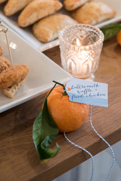 Oranges were used to anchor menu cards on the catering table.