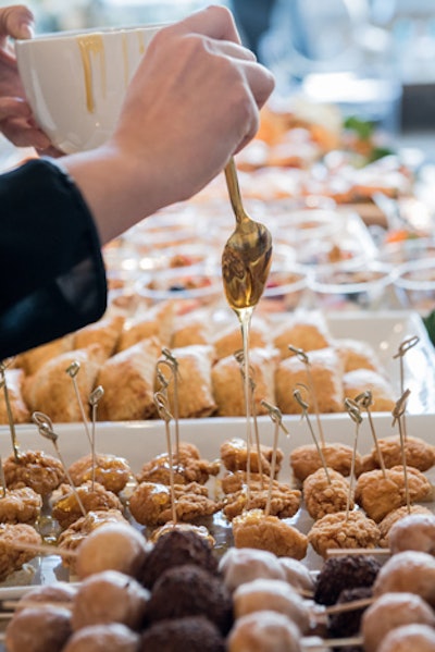 Blue Plate Catering created a fresh take on a brunch menu with dozens of mini bites, including a mini chicken and waffle drizzled with thyme syrup.