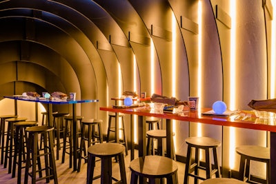The New York Design Center partnered with the New York School of Interior Design to bring to life a quintessential New York entity, the subway. The vignette featured bare-bones table settings with plastic takeout containers and Metrocards, as well as arched lighting that gave the appearance of an underground tunnel.