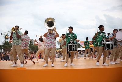 Miami-based Stryke Percussion provided entertainment from the circular stage in the champagne brand's signature hue.