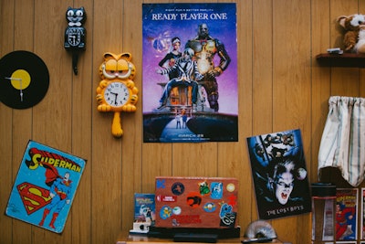 In the gaming room, tongue-in-cheek posters also evoke pop culture details of the 1980s.