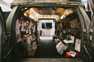 Guests can pause for photo ops at the trailers, and then enter the challenge through a secret entrance: a hollowed-out van filled with real props and papers from the movie.