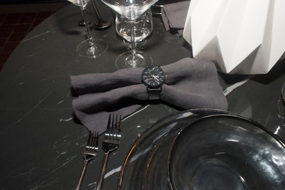 Watches served as napkin rings at each table setting.