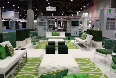 For a spring-inspired tradeshow lounge, Taylor Creative Inc. used a seasonally appropriate green and white color scheme. In addition to the Aston sofa in white ($450), the Tufted Ottoman Square in white ($285), and the Reflection Side Table ($95), green touches included a green Boheme Stool ($60), the Infinity Area rug ($400), and Peridot and Tangier pillows ($30 each).