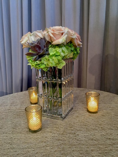 Floral centerpieces will be arranged in a variety of gold, copper, and mirrored vases.