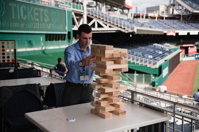 Take on a colleague with a round of Giant Jenga while overlooking the field