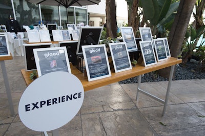 A silent auction during the cocktail hour offered items organized by category, such as 'experience' and 'travel.'
