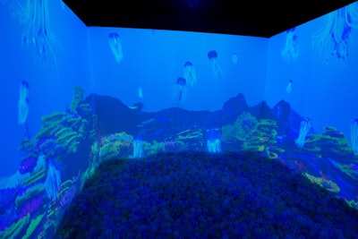 A 360-degree animated underwater projection room with a ball pit and soundscape submerged visitors into underwater life.