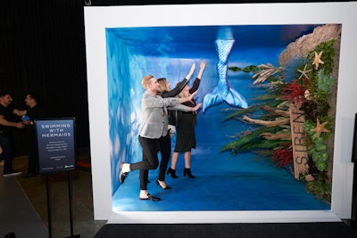 A photo-op included an underwater garden complete with seaweed, anemones, and a column of air bubbles. When shared on social media, the image was turned sideways so attendees looked as if they were swimming with mermaids.