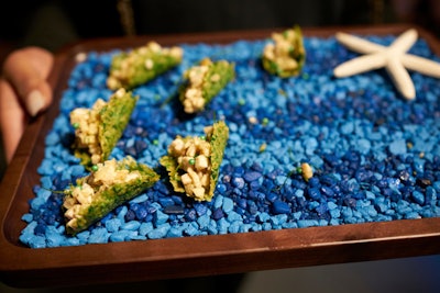 Colorful fish tank-style gravel and a starfish adorned the catering trays.