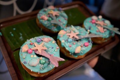 On-theme donuts from Spudnuts were decorated with shiny, candy-colored pearls, seashells, and fish tails.