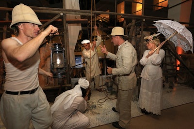 The cocktail reception was set in the year 1921, when archaeologist Howard Carter and his British sponsor, Lord Carnarvon, were searching for the tomb. Actors in vignettes represented Carter’s crew, searching for the grave in Egypt’s Valley of the Kings. Dusty scaffolding and canvas field tents added to the ambiance.
