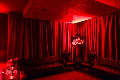 Inside, the venue was lighted in red and featured a neon sign that spelled out the name of the event.