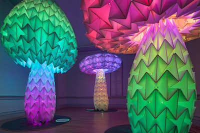Guests took in mind-bending art like the undulating neon origami mushrooms in FoldHaus’s Shrumen Lumen piece.