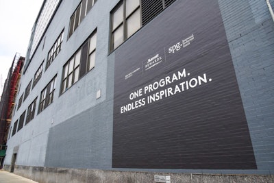 The event, which took place April 16 at Spring Studios, advertised the merger on the outside of the venue.