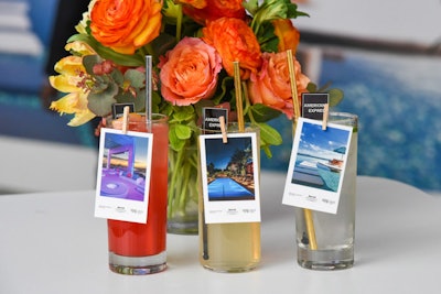 Bartenders affixed hotel and destination photos to cocktails with mini clothespins.