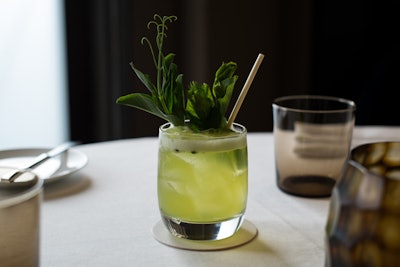 Stodel turns pea tendril scraps into a green pea oil that floats atop the Peas and Thank You cocktail, which is made with Nuestra Soledad mezcal, Bonal, lemon, pea tendril, and mint.