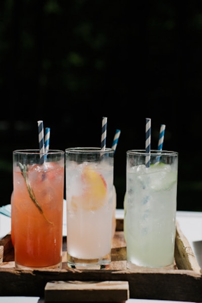 Serve signature fresh cocktails garnished with bright, edible flowers.