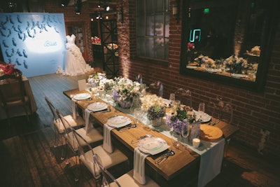 The 'Something... Blue' photo wall also was accompanied by a blue and purple tablescape.