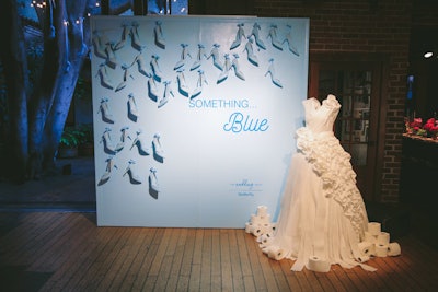Branded photo stations in the “bridal shower” area included a “Something… Blue” station decorated with light blue heels and a life-size wedding dress created with toilet paper.