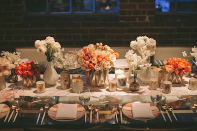 Tabletops were inspired by different wedding-reception styles. One table featured a color scheme of various shades of orange and white, with decor that included a variety of floral centerpieces.