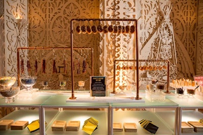 Churro wheels, cinnamon-glazed pretzels, and candied bacon hung suspended from the Gravity Dessert Art Bar.