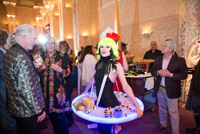 Design Cuisine creating mobile dining stations, like this attendant with a 'sushi skirt' who roamed through the crowd.