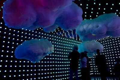 The Dream Machine's first room, 'On Cloud 9,' is designed to make guests feel as if they're walking through clouds. Rows of blue bulb lights were strung on the rooms walls and ceiling to create the effect of a sky, and clouds created with cotton were placed at different heights.